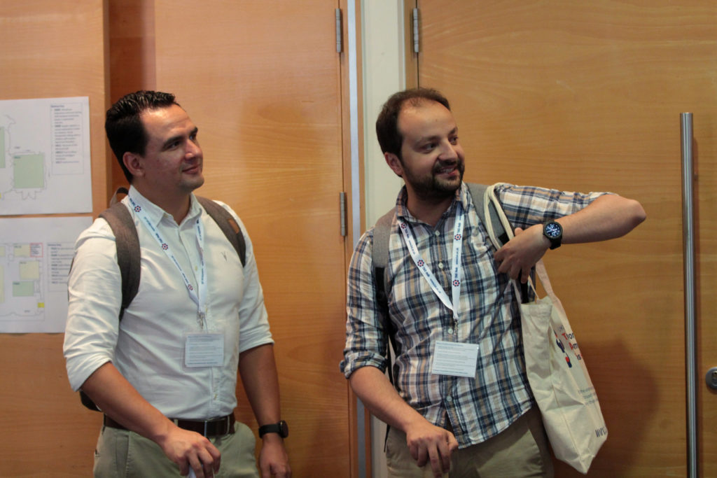 Delegates with a backpack and TAS Tote bag