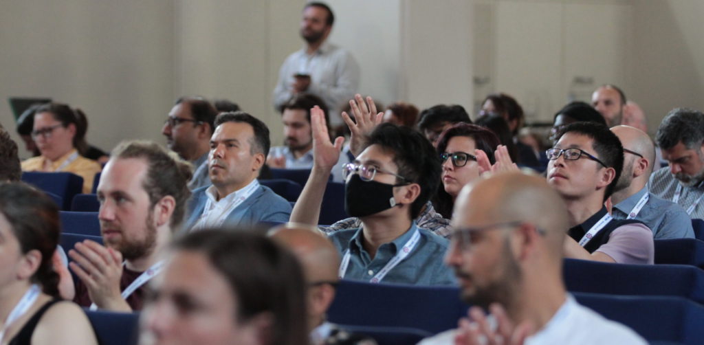 Delegates listen to talks in the main hall