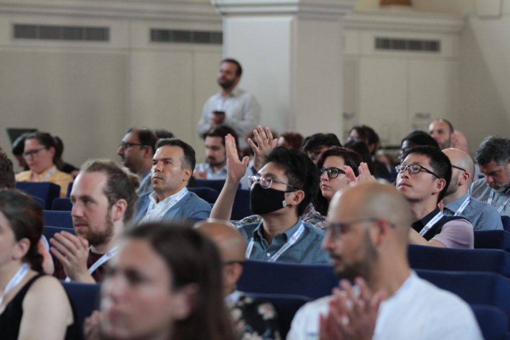 Delegates listen to talks in the main hall