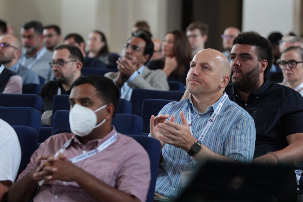 Delegates listen to talks in the main hall