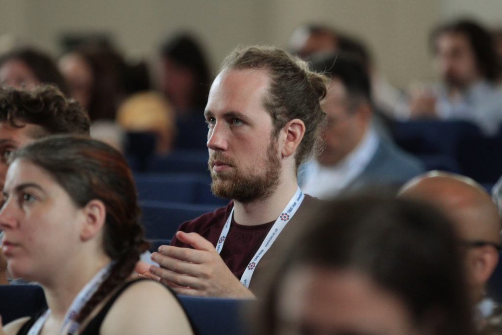 Jan Luca Kaestle listens to talks in the main hall