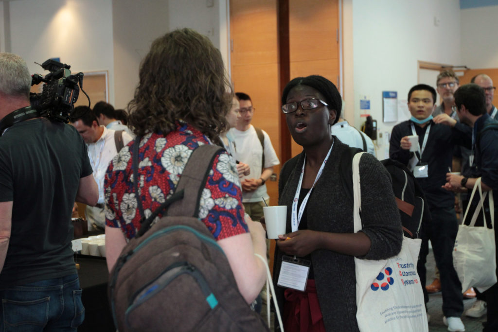 Delegates talking during the tea break