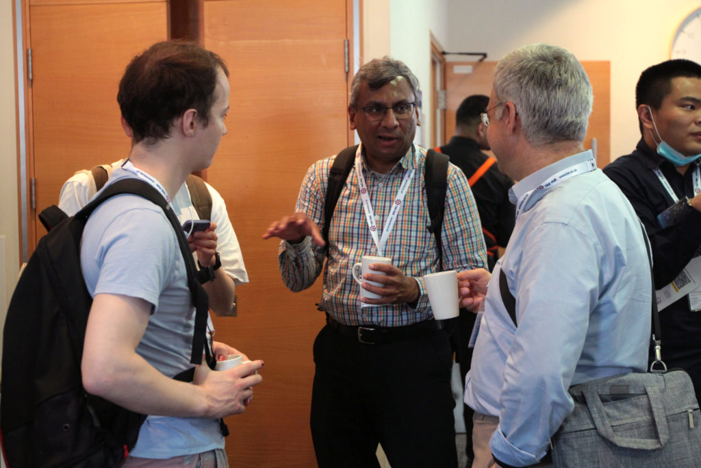 Professor Subramanian Ramamoorthy networking during the break