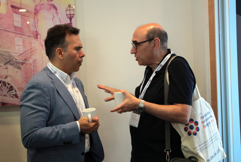 Delegates in discussion during the coffee break