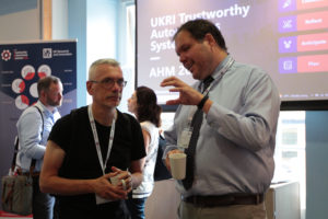 Professor Steve Benford and James Dracott talking during the break (l-r)