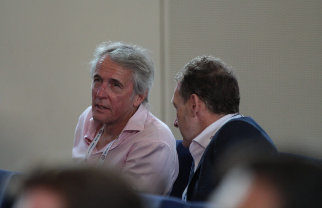 Delegates discussing in the main hall