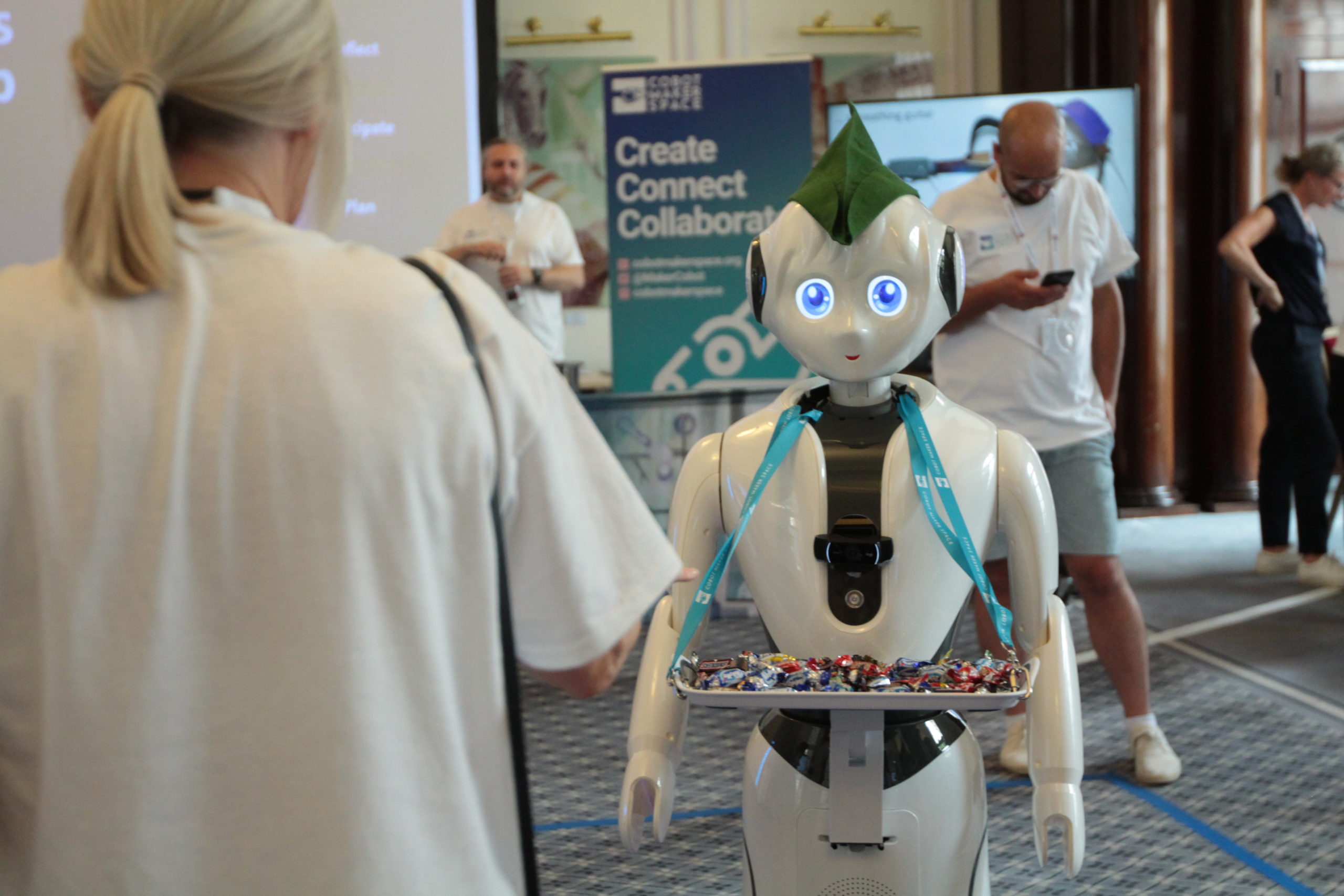 Pepper the Robot with a tray of chocolates
