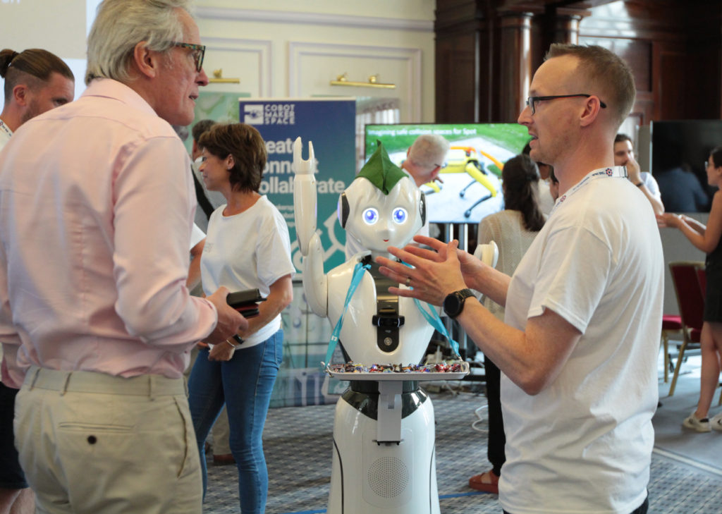 Delegates visit Pepper the robot at the Cobot Maker Space demo