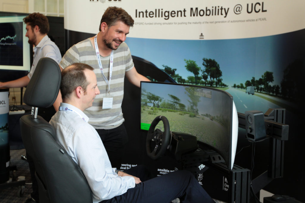 A delegate seated in the driving seat.