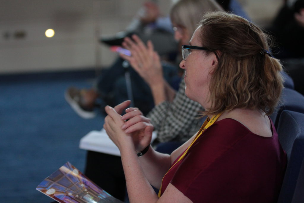 Dr Kate Devlin clapping her hands