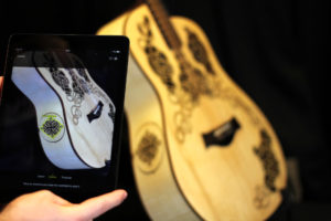 A guitar with intricate art codes embedded into its bodywork