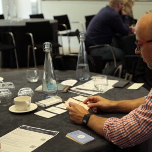 Male researcher using RRI Prompt and Practice Cards